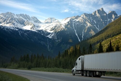 truck driving towards mountains