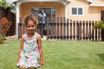 child in front of home