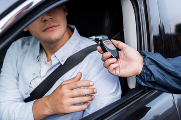 man with breathalyzer