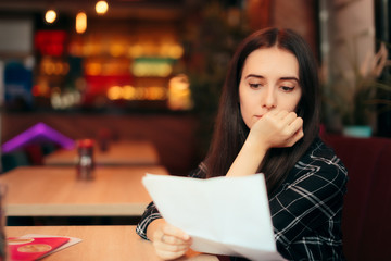 sad woman holding divorce papers